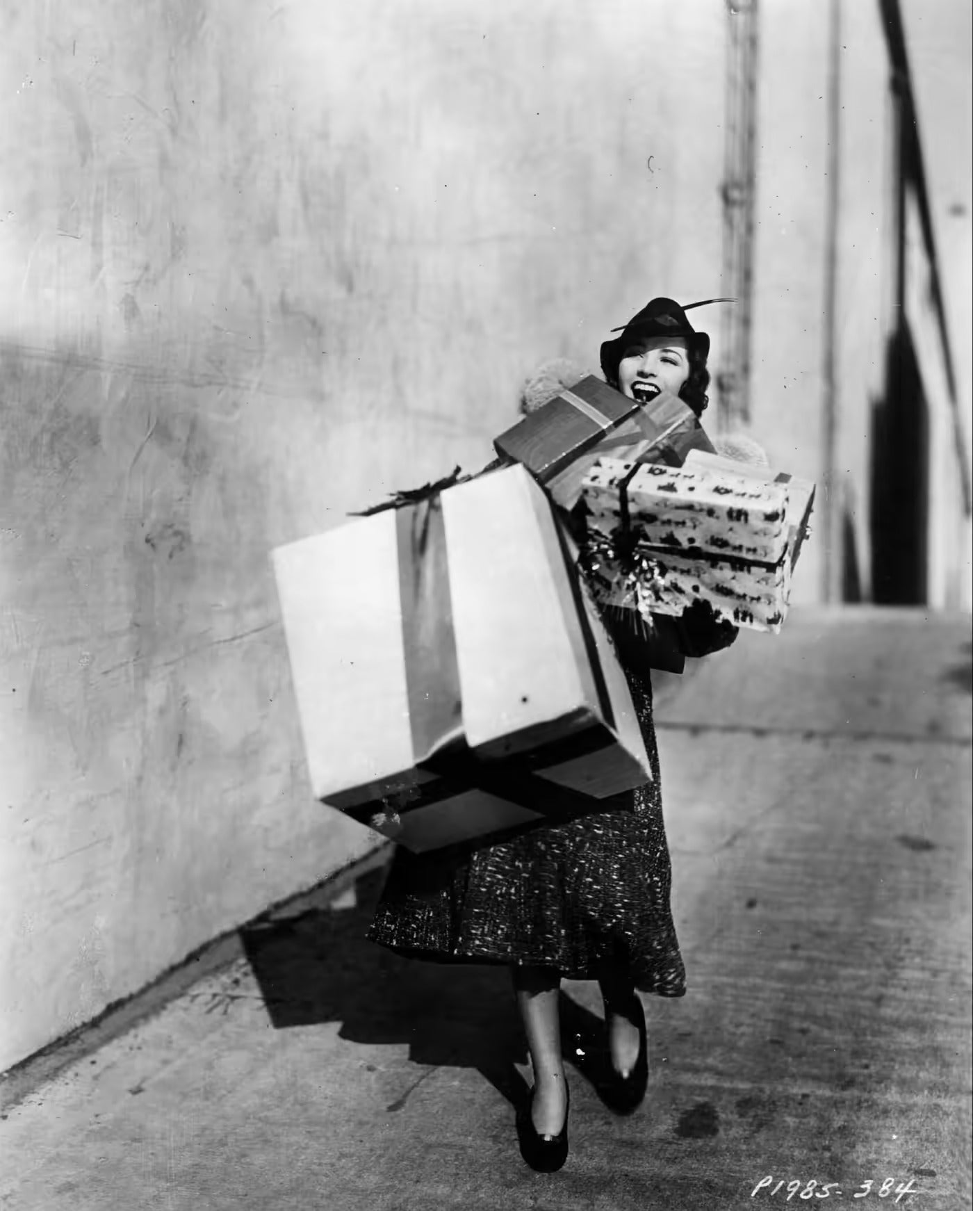 vintage photo of fashionable woman carrying gifts
